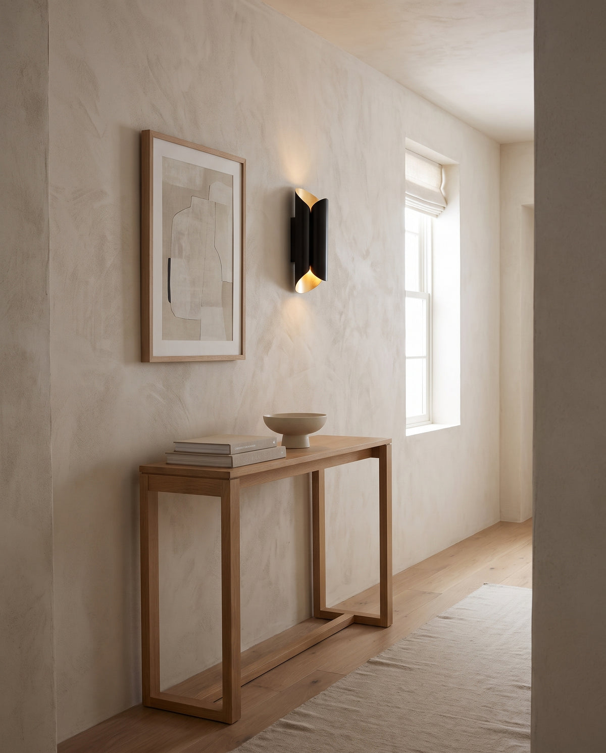 Applique murale en acier feuille d'or et noir 19x43cm Banks - Hudson Valley Lighting en situation