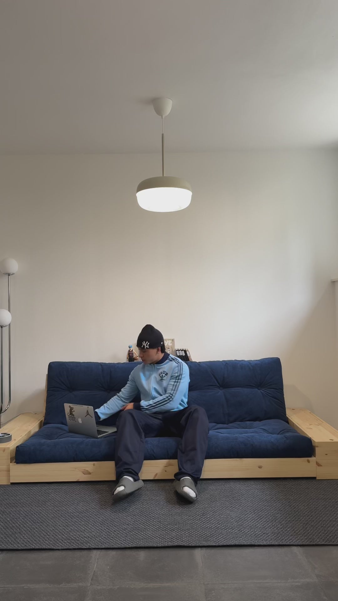 Load video: Convertible sofa with storage in pine with black back and dark gray mattress Base - Karup Design